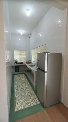 a kitchen with a stainless steel refrigerator in a room at Sunya Home Basement Raub Pahang in Raub