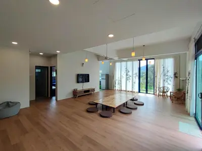 a large living room with a wooden table and chairs at Sunya Home Basement Raub Pahang in Raub
