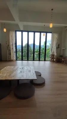 a large room with a table and large windows at Sunya Home Basement Raub Pahang in Raub