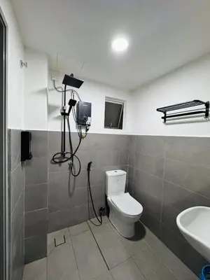 a bathroom with a white toilet and a sink at Casa De Olive Islamic Only in Kampong Batu Lapan