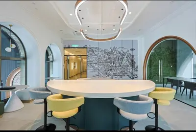 a dining room with a round table and chairs at Urban Studio 22Macalisterz- Washer and Nespresso in George Town