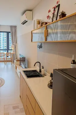 a kitchen with a sink and a counter top at Urban Studio 22Macalisterz- Washer and Nespresso in George Town