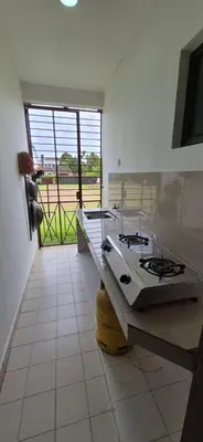 a kitchen with a stove and a view of a field at Striatus by Holiday Pool Villa A'Famosa Resort in Gua Sai