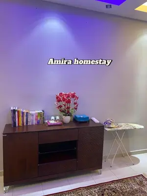 a sign on a wall that says antina homogeneity at Amira homestay in Kampong Batu Lima