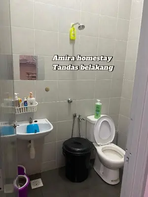 a bathroom with a toilet and a sink at Amira homestay in Kampong Batu Lima