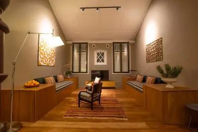 a living room with couches and a table at Argus Residences in George Town