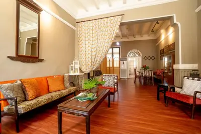a living room with a couch and a table at Argus Residences in George Town