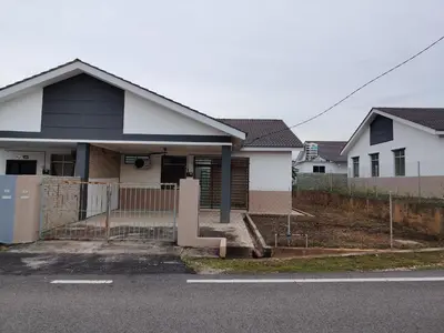 a house with a fence in front of it at Unit 3 Islam Taqwa Homestay in Kuala Lipis