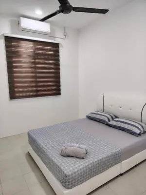 a bed in a white room with a ceiling at Unit 3 Islam Taqwa Homestay in Kuala Lipis