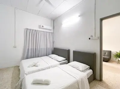 a room with two beds and a mirror at Pearl Cottage - 2min Drive to Lam Wah Ee Hospital in George Town