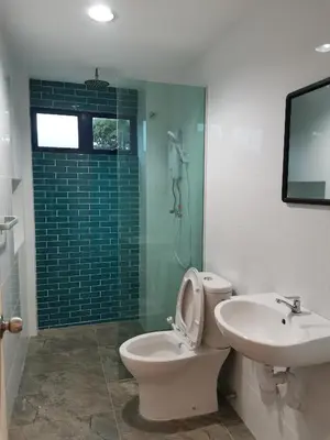 a bathroom with a toilet and a sink and a shower at Sunya Home Ground Floor Raub Pahang in Raub