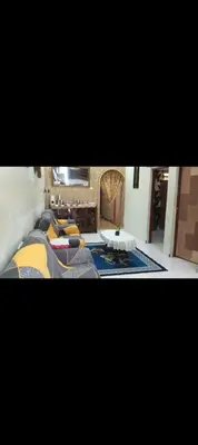 a view of a living room with a table and chairs at Taman Mas Falim in Gua Sai