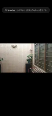 a picture of a bathroom with a window and a plant at Taman Mas Falim in Gua Sai