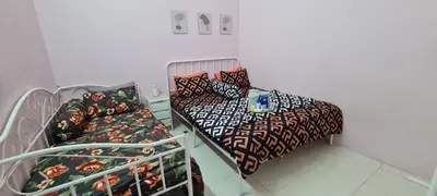 a hospital room with two beds and a table at Ruma Inn Homestay Perlis in Gua Sai
