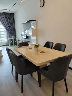 a dining room with a table and chairs at The Anderson by Triple G Homes in Ipoh