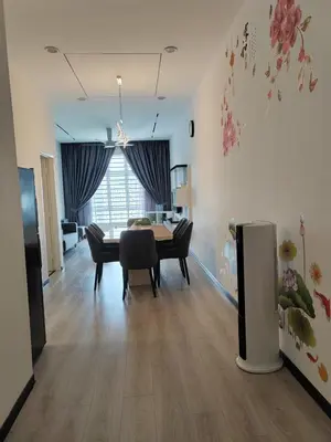 a living room with a table and a dining room at The Anderson by Triple G Homes in Ipoh