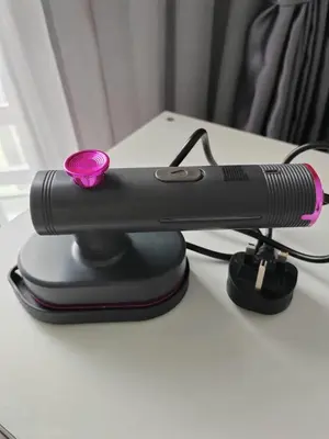 a black microphone sitting on top of a table at The Anderson by Triple G Homes in Ipoh