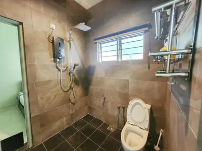 a bathroom with a toilet and a shower at Ipoh Tambun pool villa 5br 18pax bbq mahjong in Tambun