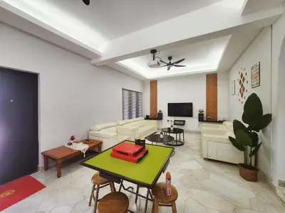 a living room with a couch and a table at Ipoh town7br5bath 25 pax pool table mahjong karaok in Ipoh