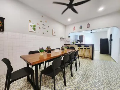 a dining room with a table and chairs in a kitchen at Ipoh town7br5bath 25 pax pool table mahjong karaok in Ipoh