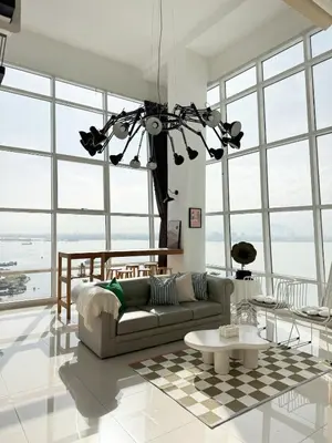 a living room with a couch and a table at Maritime Suite Full Seaview Georgetown in George Town