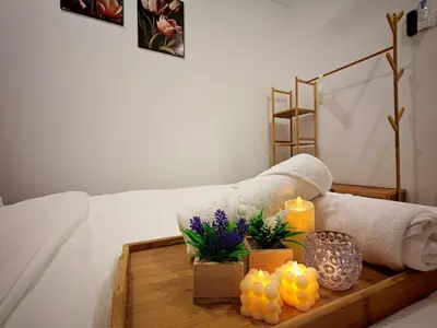 a living room with a couch with a table with candles at Ipoh Manhattan Waterpark Suite by City Home Empire MHB403 in Ipoh