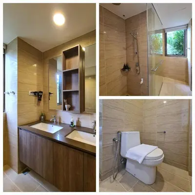 two pictures of a bathroom with a toilet and a sink at By The Sea - Beachfront Bliss at Batu Ferringhi in Batu Ferringhi