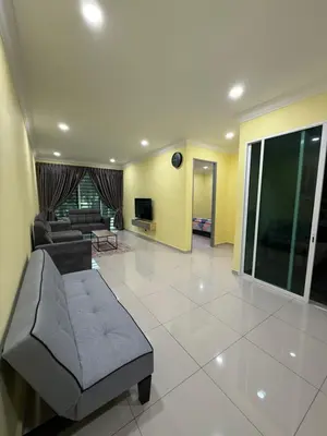 a large living room with a couch and a tv at Mossy Green Golfcourse Homestay in Tanah Rata
