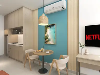 a kitchen with a table and chairs in a room at 22 Macalisterz by MyKey in George Town