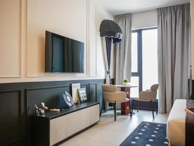 a hotel room with a bed and a tv at 22 Macalisterz by MyKey in George Town