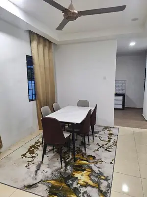 a dining room with a table and chairs on a rug at Zehra Villa Seri Iskandar with Private Pool in Seri Iskandar
