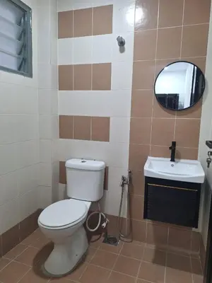 a bathroom with a toilet and a sink at Zehra Villa Seri Iskandar with Private Pool in Seri Iskandar