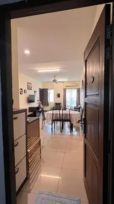 a view of a kitchen and living room from the hallway at Tower Regency Hotel & Apartments in Ipoh