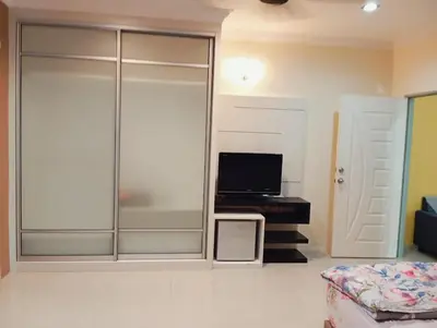 a living room with a sliding glass door at HD Jaya Shine Homestay in Sungai Petani