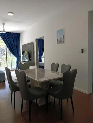 a dining room with a wooden table and chairs at Ereens homestay Cameron highland in Brinchang