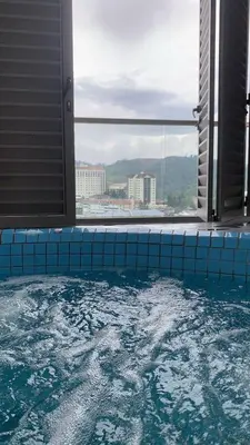 a large swimming pool with a view of a city at Ereens homestay Cameron highland in Brinchang