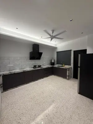 a large kitchen with a ceiling fan in a room at LiveLikeYourHome, RajaUda Butterworth
