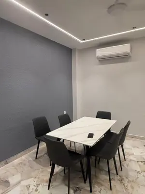 a meeting room with a table and chairs at LiveLikeYourHome, RajaUda Butterworth