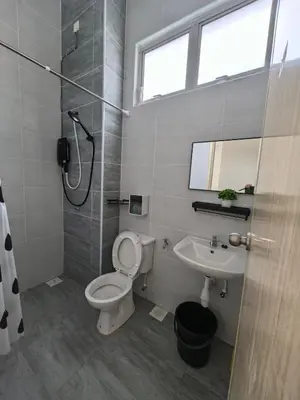 a bathroom with a toilet and a sink and a shower at Padang Serai Wangi Homestay 55 in Gua Sai