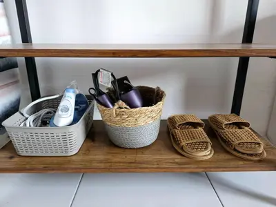 a shelf with two baskets and some items on it at #MyHillsideHideaway at Quintet, Cameron Highlands in Tanah Rata