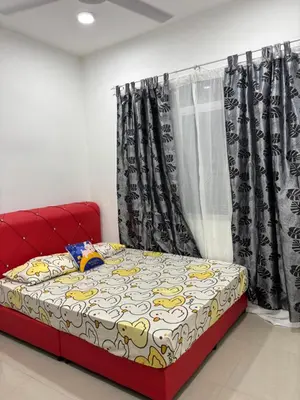 a red bed in a room with a window at Healing Homestay in Kampong Changkat Sedonan