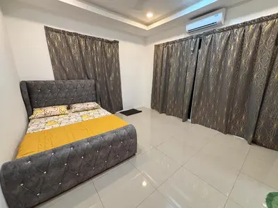 a bedroom with a bed in a room at Healing Homestay in Kampong Changkat Sedonan