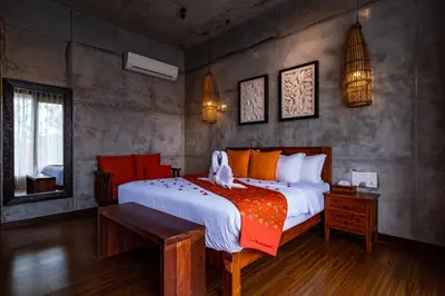 a bedroom with a large bed in a room at Ipoh Bali Hotel in Ipoh