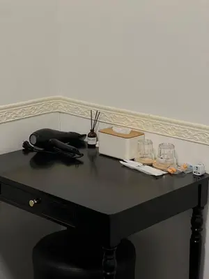 a black table with a box and glasses on it at Bali Nordic American Guest House Style By Nest at Beach St George Town Penang in George Town