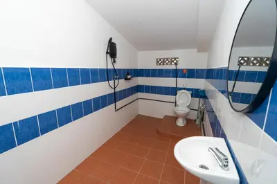 a bathroom with a sink and a toilet at Bali Nordic American Guest House Style By Nest at Beach St George Town Penang in George Town
