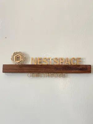 a sign on a wall that reads at Bali Nordic American Guest House Style By Nest at Beach St George Town Penang in George Town