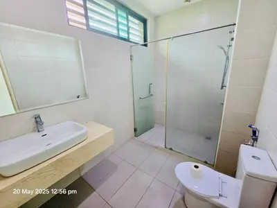 a bathroom with a sink and a shower and a toilet at Cozy Villa - Private Pool, 5BR, KTV, BBQ, PS5 just 3 Mins to Batu Ferringhi Beach! in Batu Ferringhi