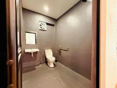 a bathroom with a toilet and a sink at WhiteZen Family Homestay 9Room for 20pax Central Penang in Jelutong