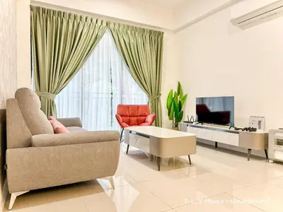 a living room with a couch and a tv at The Cove Hillside Residence Ipoh by PLY Home in Ipoh