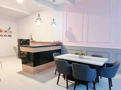 a dining room with a table and a piano at Sitiawan 2-storey 4room5BedsWifi 10pax near Jetty in Sitiawan